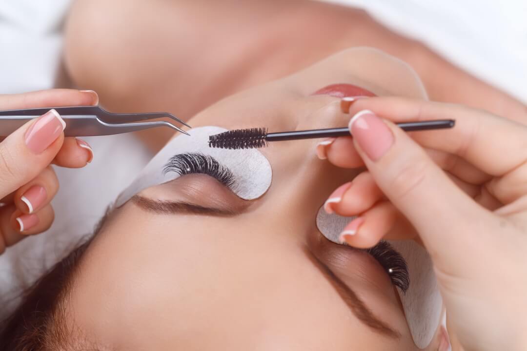Eyelash Extension Procedure. Woman Eye with Long Eyelashes. Eyelashes with rhinestone. Lashes, close